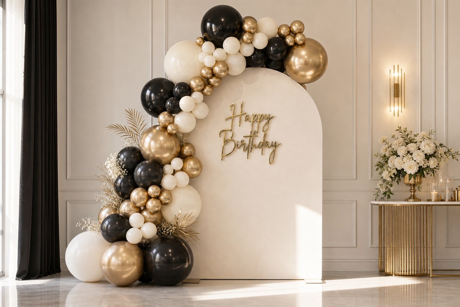 Signature ivory arch backdrop with champagne gold Happy Birthday sign and balloon garland