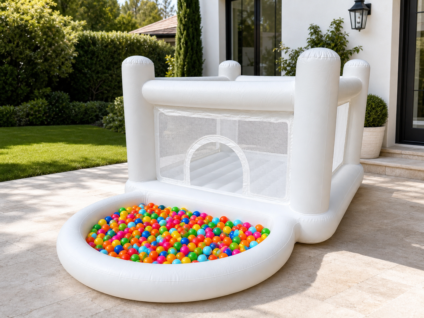 White Bouncy Castle with built-in trampoline and included ball pit balls